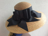 Palm Straw in a lovely large brim with an elegant black bow